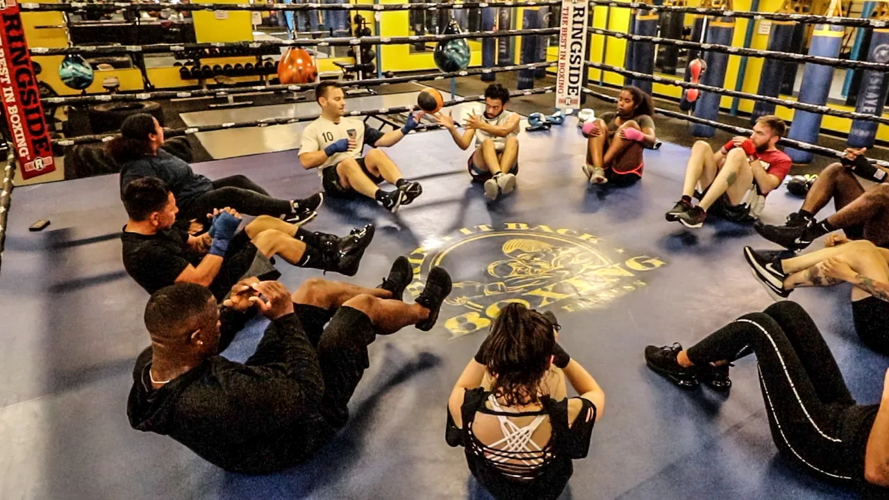 Adult class completing conditioning drills
