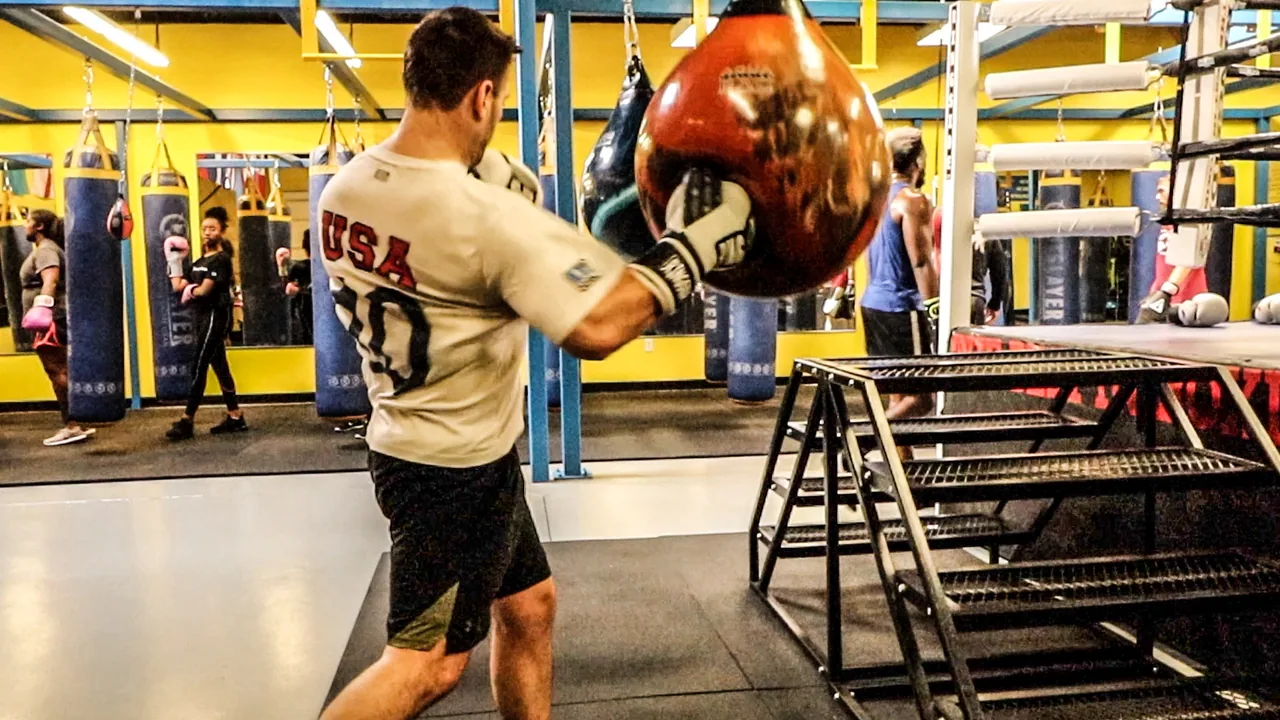Adult boxer working the speed bag