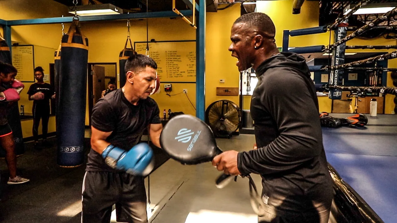 Advanced boxer working with a coach